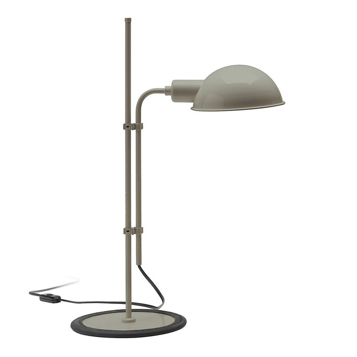 "Modern beige lamp with a sleek metal shade and black circular base, perfect for contemporary decor."