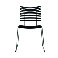 Black striped dining chair with sleek silver legs, showcasing a modern and minimalist design.