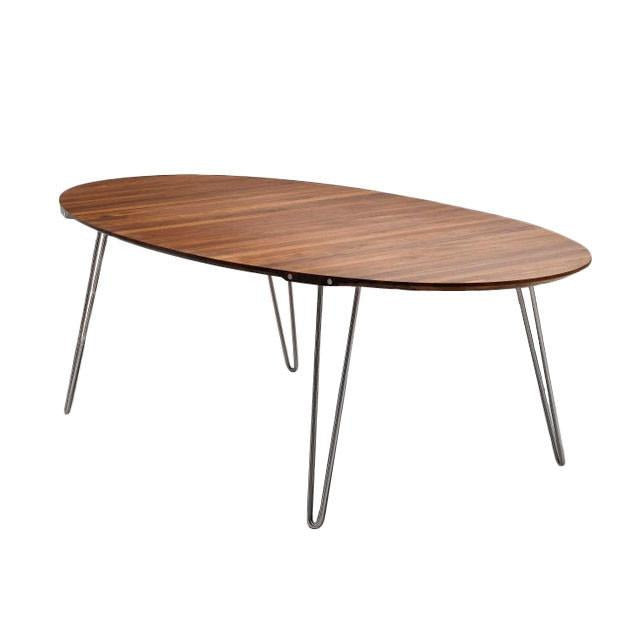 Wooden oval tabletop with a rich brown finish and subtle grain patterns, supported by sleek metal legs.