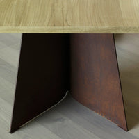 Rustic wooden tabletop with a sleek, brown metal base featuring a textured finish. Modern design elements combined.
