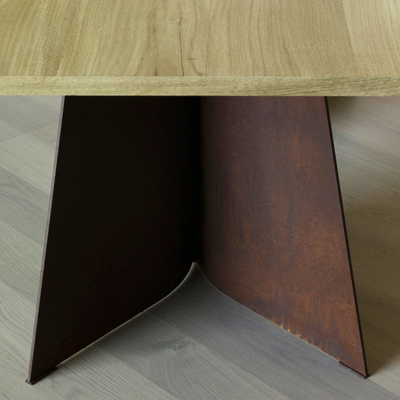 Rustic wooden tabletop with a sleek, brown metal base featuring a textured finish. Modern design elements combined.
