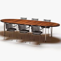 Oval wooden dining table with a warm brown finish, accompanied by sleek silver striped metal chairs.