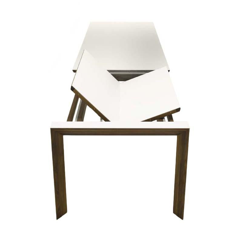 Modern white tabletop with angled design, complemented by a sleek dark wood frame. Stylish and minimalist.