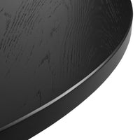 Black wooden serving tray with a smooth, curved edge and subtle wood grain pattern. Perfect for modern decor.