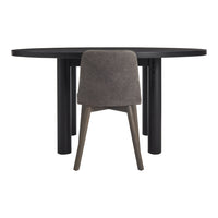 Round black dining table with a textured grey upholstered chair, showcasing a sleek, modern design.