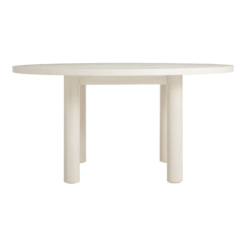 Round white dining table with a smooth finish and minimalist design, featuring simple cylindrical legs.