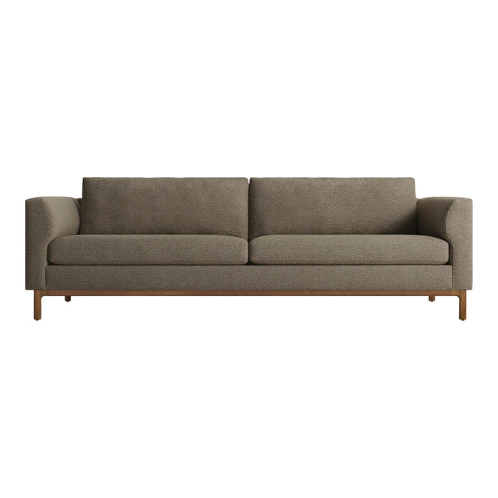 Sleek sofa in earthy taupe fabric with smooth texture and simple, modern design. Elegant wooden legs add warmth.