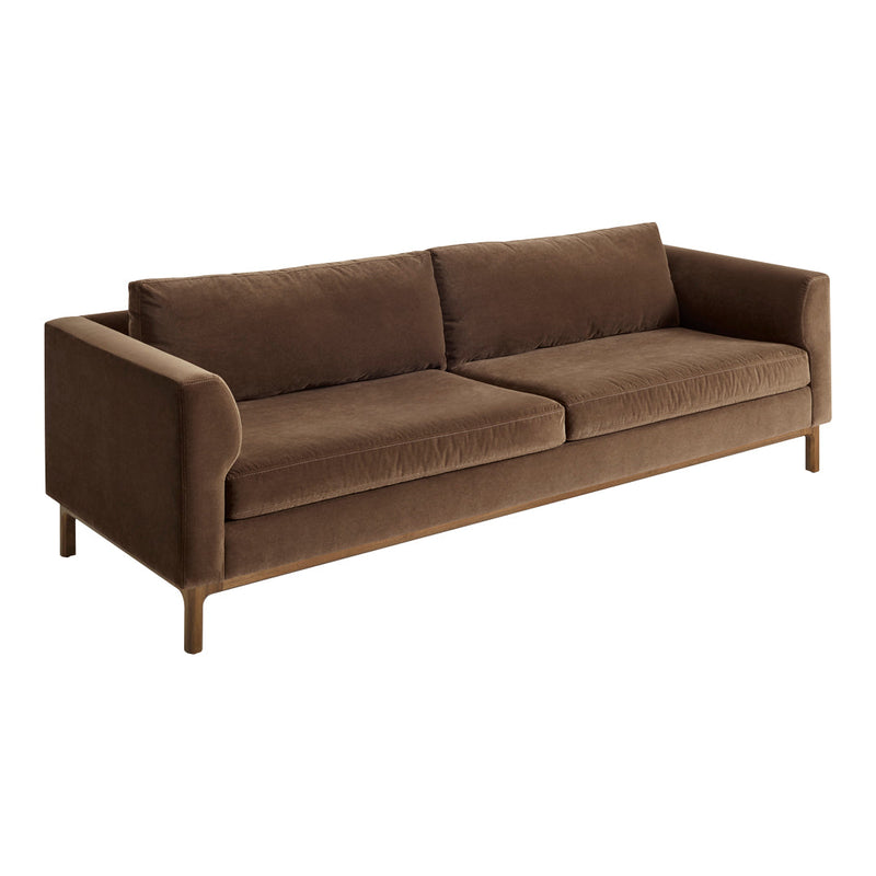 Brown velvet sofa with a sleek, modern design and smooth, solid color upholstery. Ideal for contemporary living rooms.