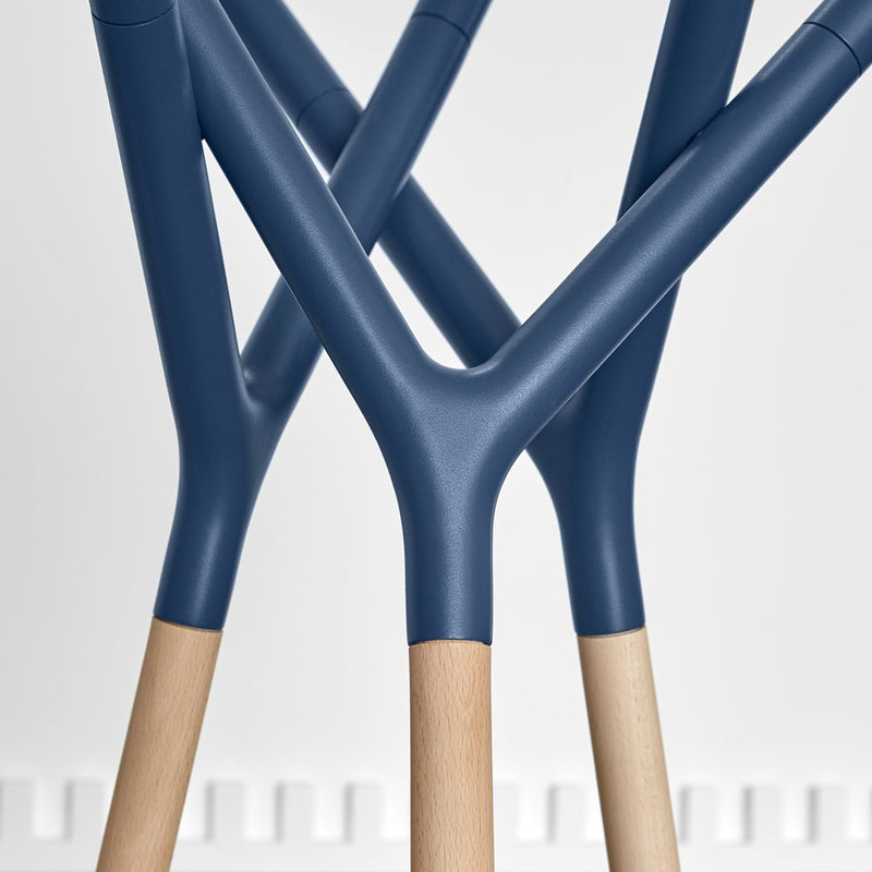 Navy blue legs with natural wood accents in a modern geometric design. Ideal for stylish home decor.