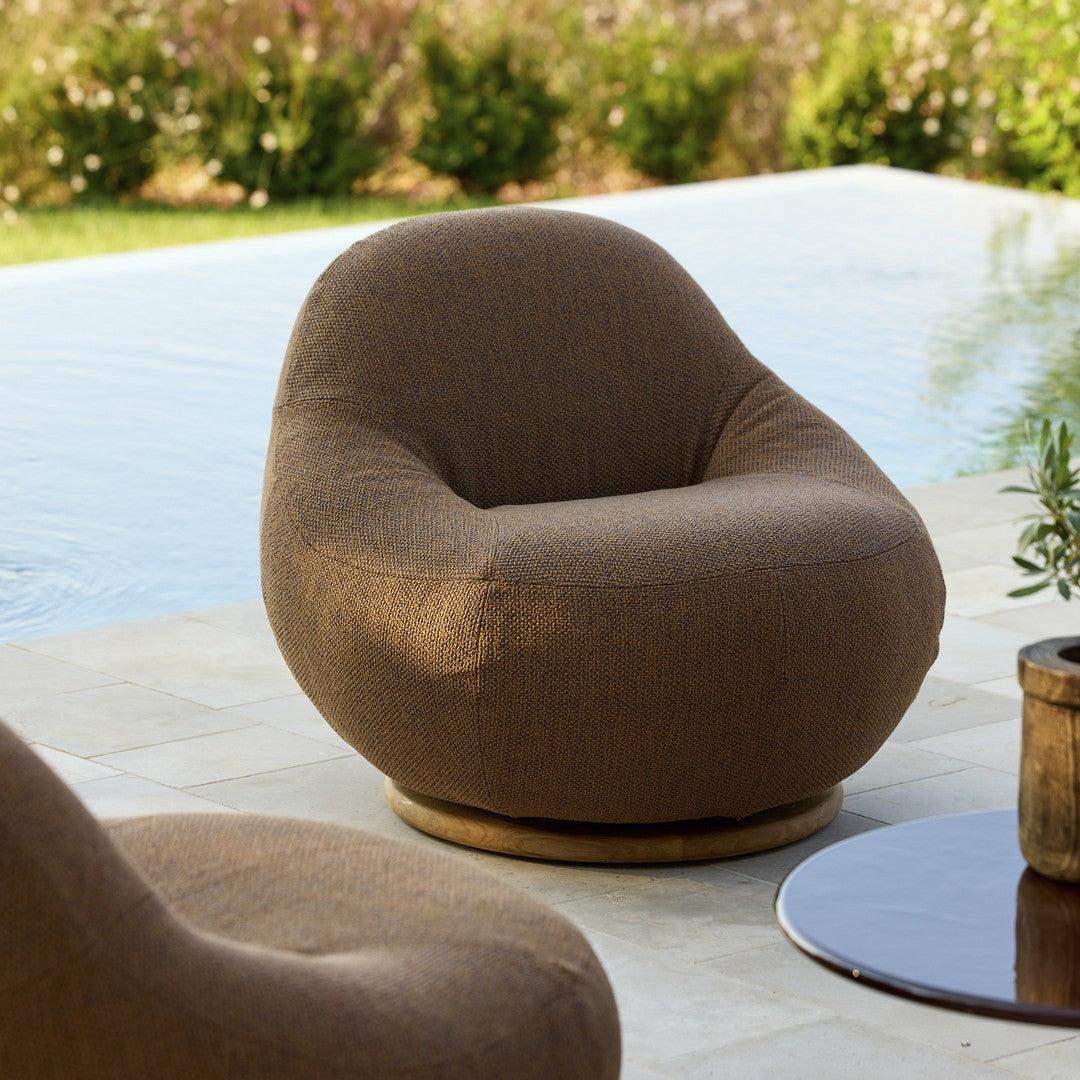 Brown textured swivel chair with a rounded design, perfect for outdoor spaces and modern decor.