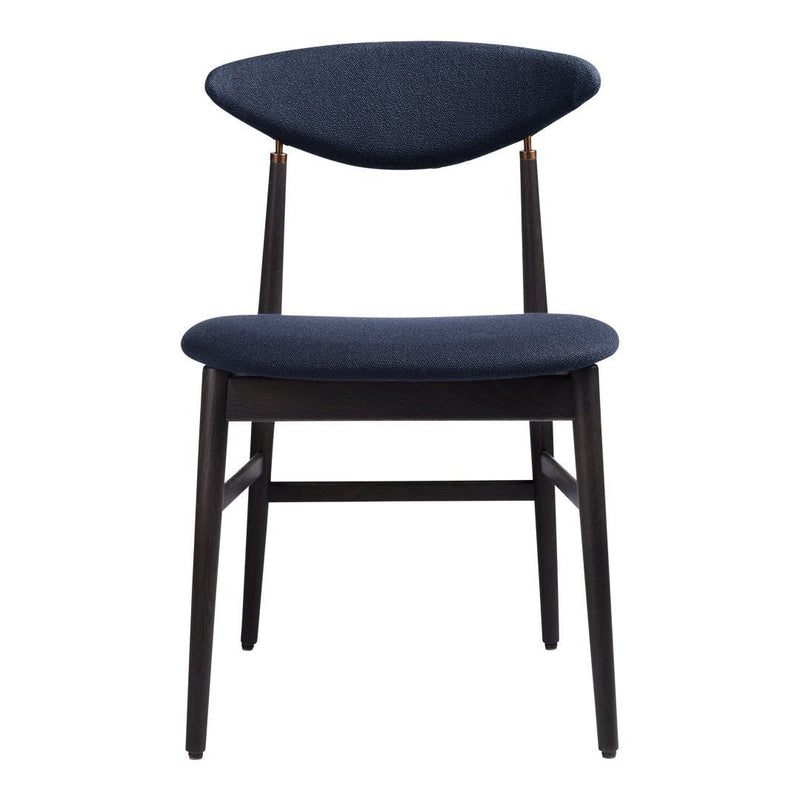 Navy blue upholstered dining chair with a sleek design and contrasting dark wood legs. Modern minimalist pattern.