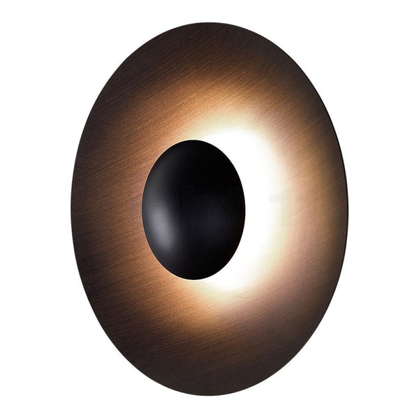 Modern oval wall light with a sleek bronze finish, black center, and warm LED glow, perfect for contemporary decor.