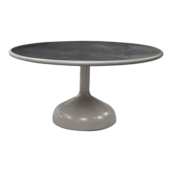 Round table featuring a sleek grey base and a dark patterned tabletop, ideal for modern decor.
