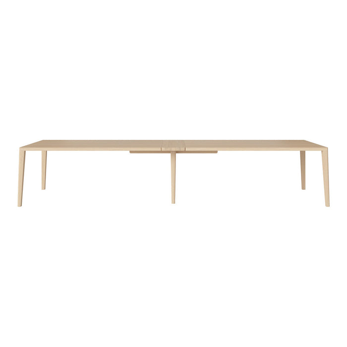 Light wood dining table with a minimalist design and smooth finish, perfect for modern interiors.