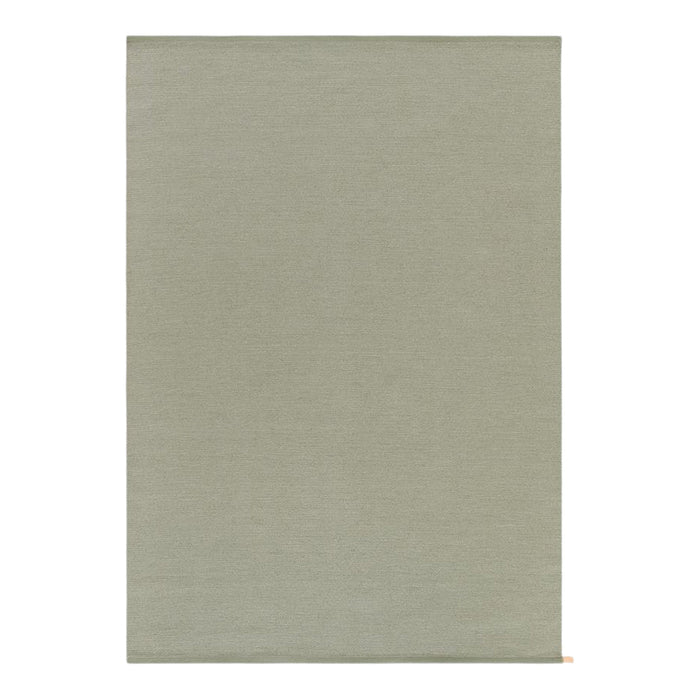 Solid olive green rug with a soft, smooth texture, perfect for adding warmth to any room.
