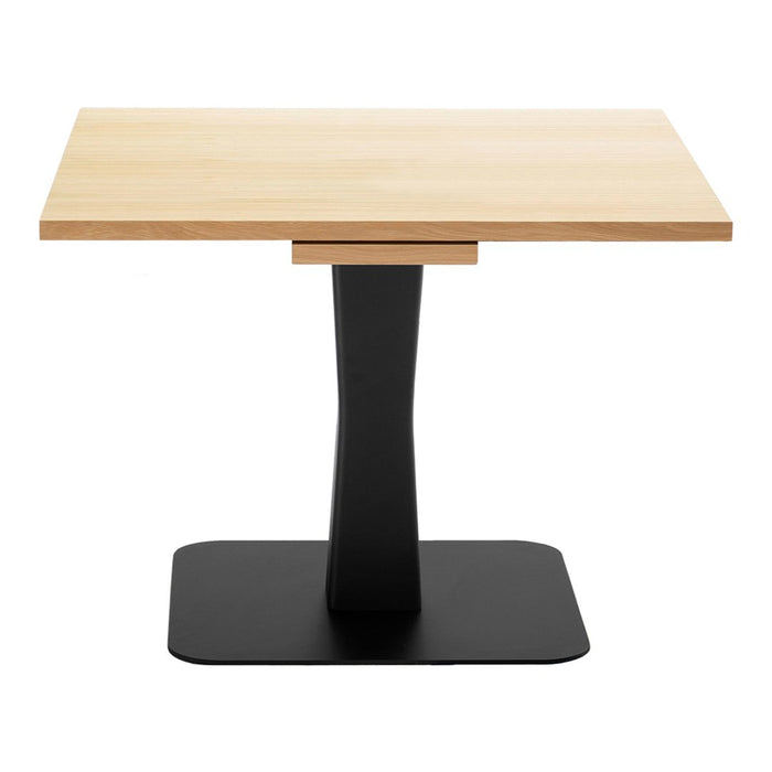 Lightwood tabletop with a smooth finish, paired with a sleek black metal base. Modern, minimalistic design.