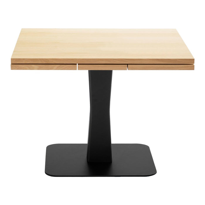 Light maple tabletop with natural wood grain and a sleek black metal base. Modern design in neutral tones.