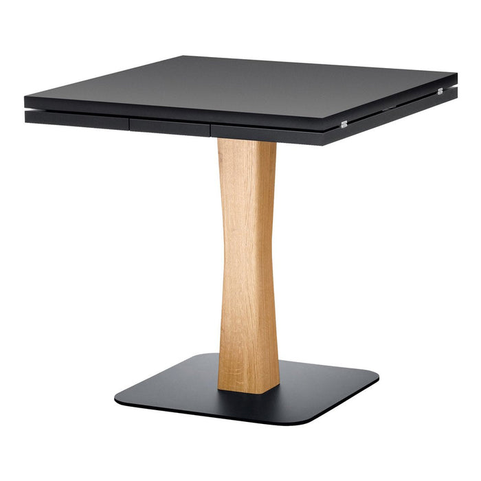 Black square tabletop with a natural wood base in light oak, featuring a sleek modern design.