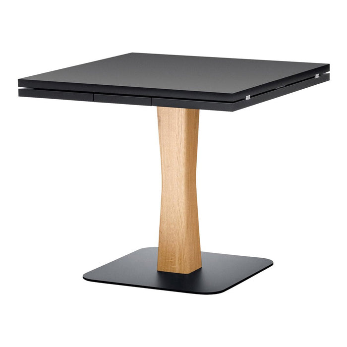 Square black tabletop with natural wood base, featuring smooth finishes and modern minimalist design.