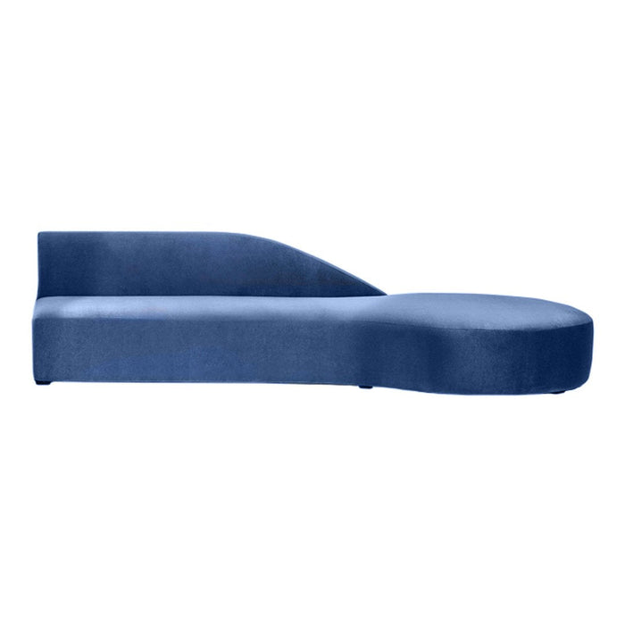 Modern chaise lounge in deep navy blue with a sleek, curved design and soft, textured fabric. Perfect for stylish interiors.
