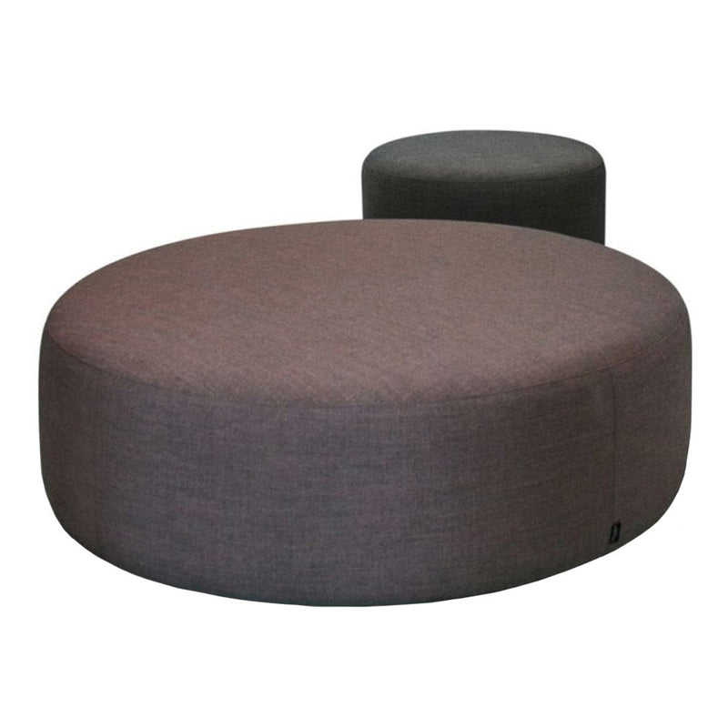 Round poufs in subdued gray and deep maroon fabric, featuring a textured finish for a modern touch.