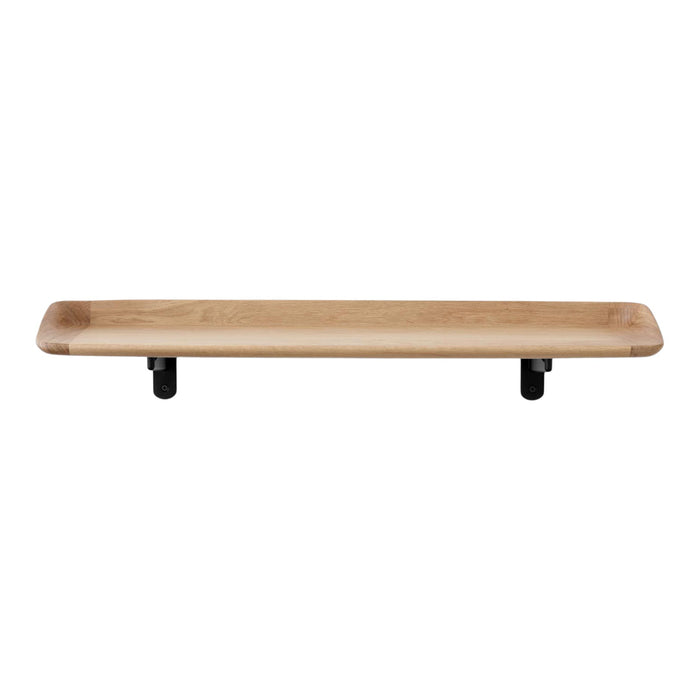 Natural wood shelf with a smooth beige finish and black pipe brackets, showcasing a minimalist design.