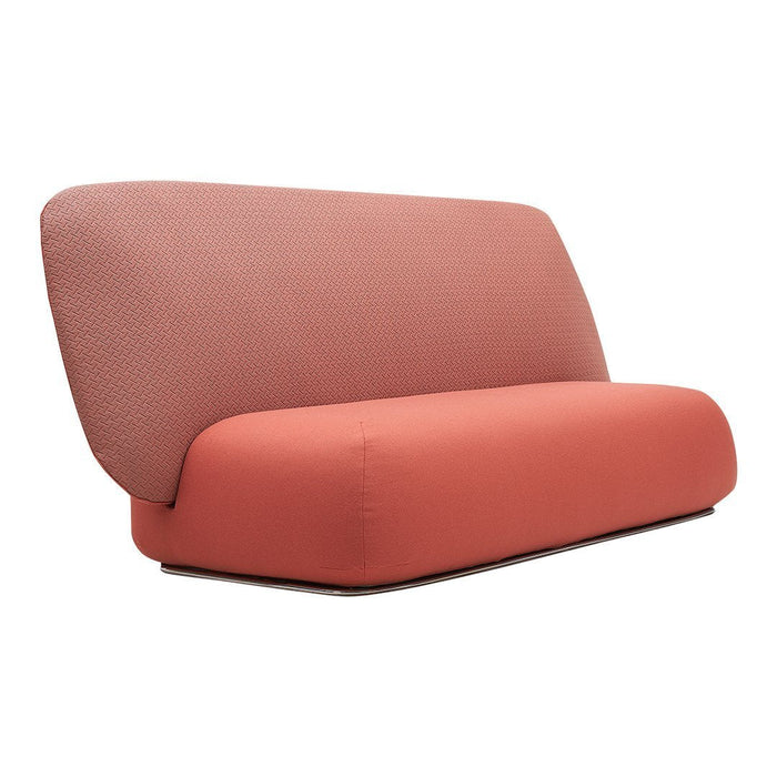 Coral pink sofa with a textured backrest and smooth, sleek design, ideal for modern living spaces.