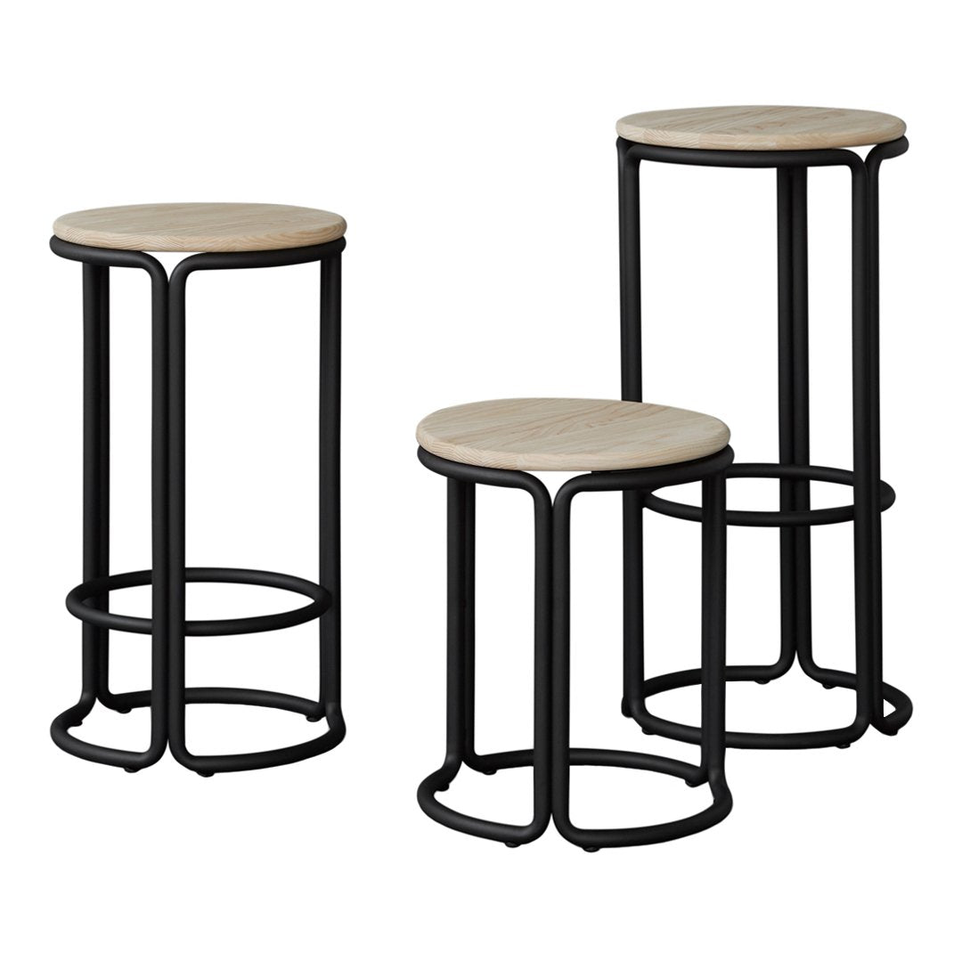 "Set of three modern stools with natural wood tops and sleek black metal frames, featuring a minimalist design."