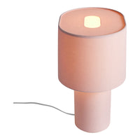 Soft pink lamp with a smooth fabric shade and cylindrical base, featuring a simple, modern design.