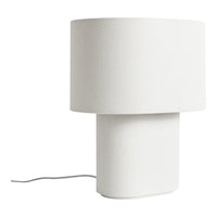 Minimalist white lamp with a cylindrical base and rounded shade, featuring a smooth fabric texture.