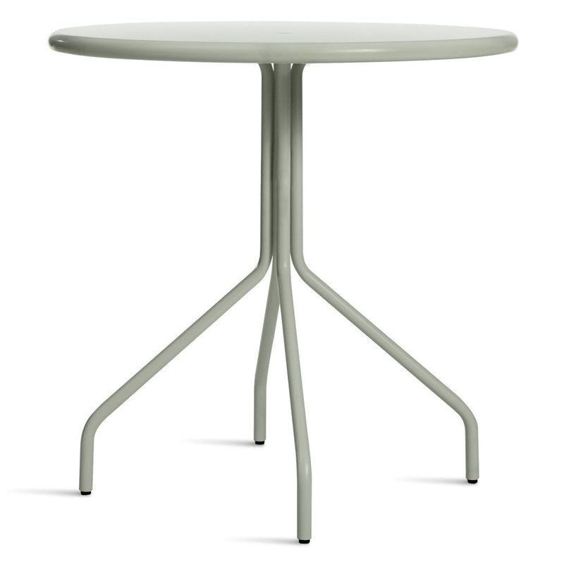 Light green round table with a smooth surface and minimalist design, featuring three sleek legs for modern decor.