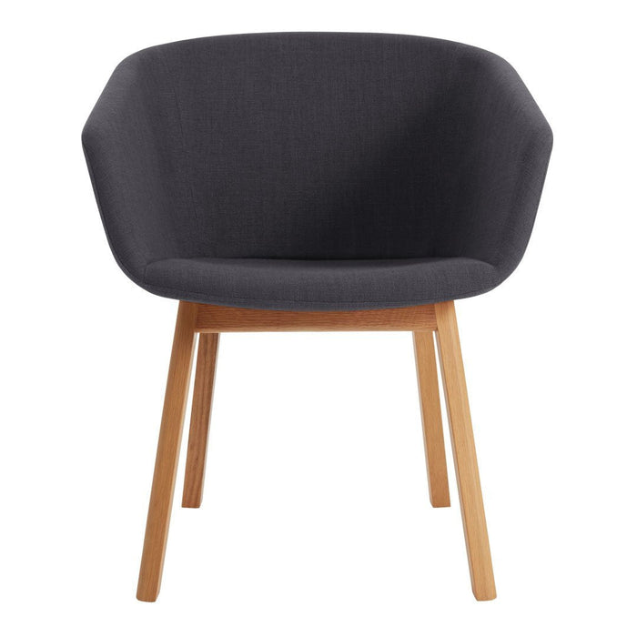 Gray upholstered chair with a modern hexagonal shape and light wood legs.
