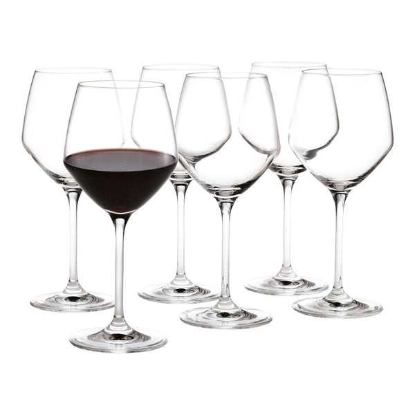 Set of six clear glass wine glasses with elegant shapes, showcasing one filled with deep red wine.