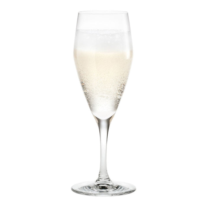 Elegant clear flute glass with sparkling pale gold bubbly drink, showcasing fine bubbles and a smooth surface.