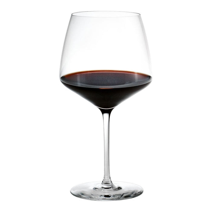Elegant glass of red wine with a deep burgundy color, showcasing a smooth, refined surface. Perfect for any occasion.