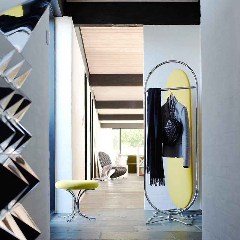 Modern hallway with yellow accents, sleek gray walls, and shiny metallic elements. Stylish minimalist decor.