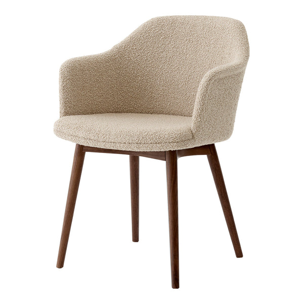 Beige textured fabric armchair with curved silhouette and wooden legs, offering a warm and cozy aesthetic.
