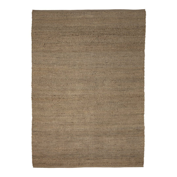 Natural woven rug in warm beige tones with a subtle textured pattern, perfect for cozy interiors.