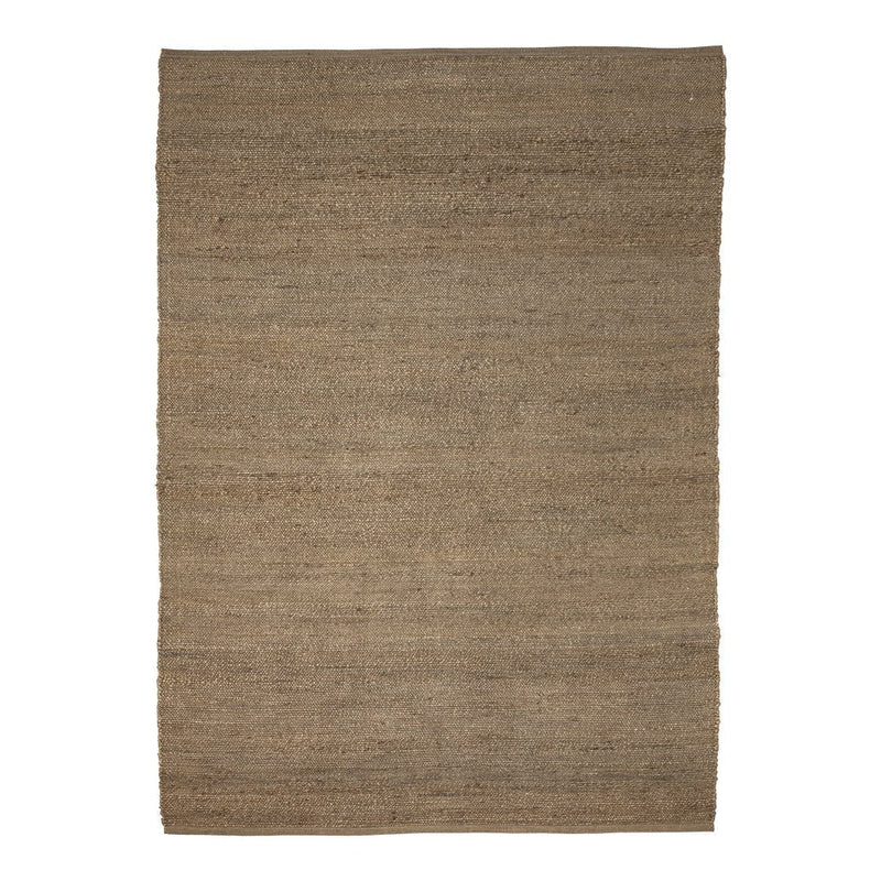 Natural woven rug in warm beige tones with a subtle textured pattern, perfect for cozy interiors.
