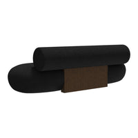 Black cylindrical cushions with a contrasting dark wood base, featuring a smooth, minimalist design.