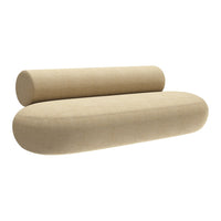 Beige oval sofa with textured fabric and seamless design, featuring a matching cylindrical bolster cushion.