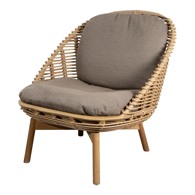 Rattan chair with natural woven pattern and soft gray cushion, perfect for stylish indoor or outdoor decor.
