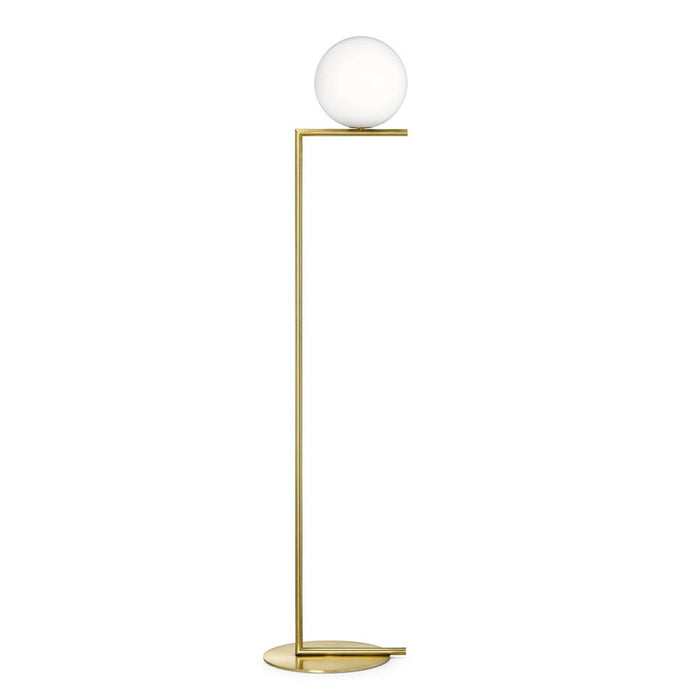 Gold floor lamp with a round white glass shade, featuring a sleek, modern design and minimalistic lines.