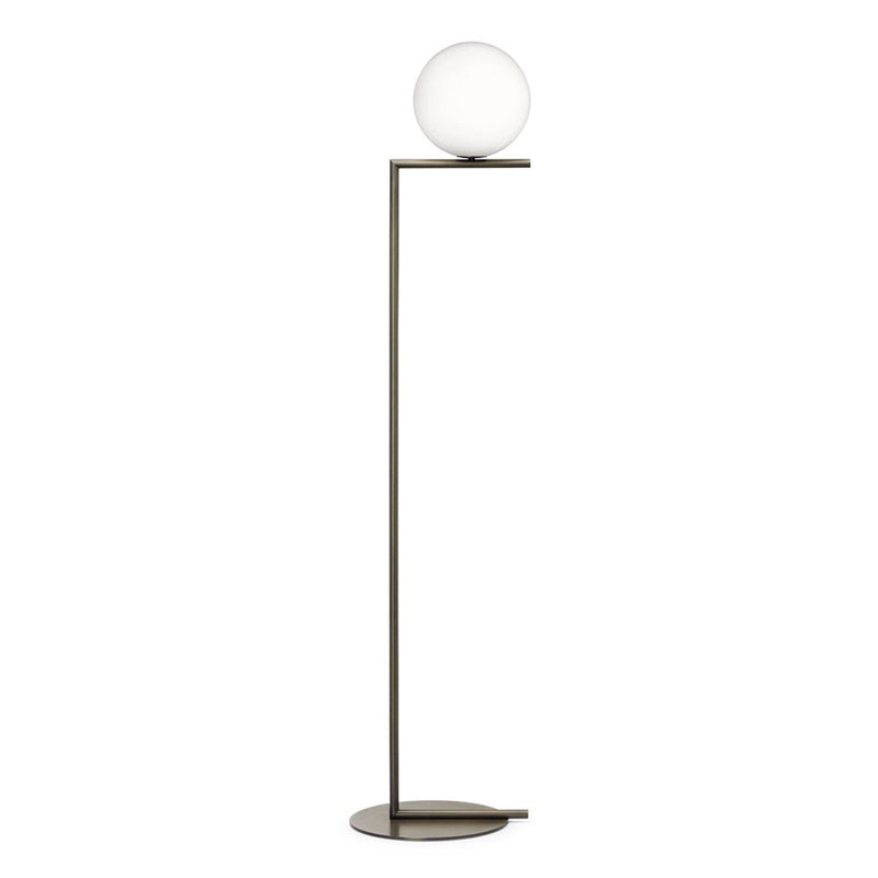 Sleek black floor lamp with a round white glass shade and minimalistic design, perfect for modern decor.
