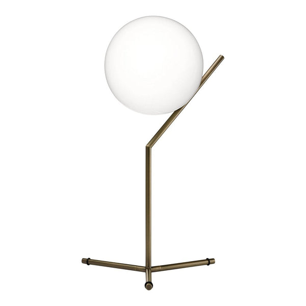 Modern table lamp with a sleek brass base and a large round white glass globe. Minimalist design with clean lines.