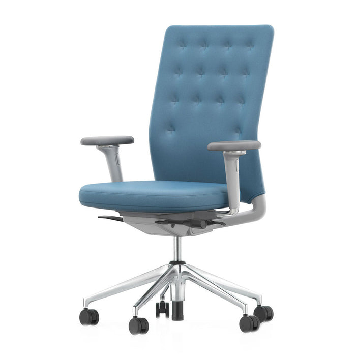 Blue tufted fabric office chair with sleek silver accents and a modern design. Ideal for stylish workspace decor.