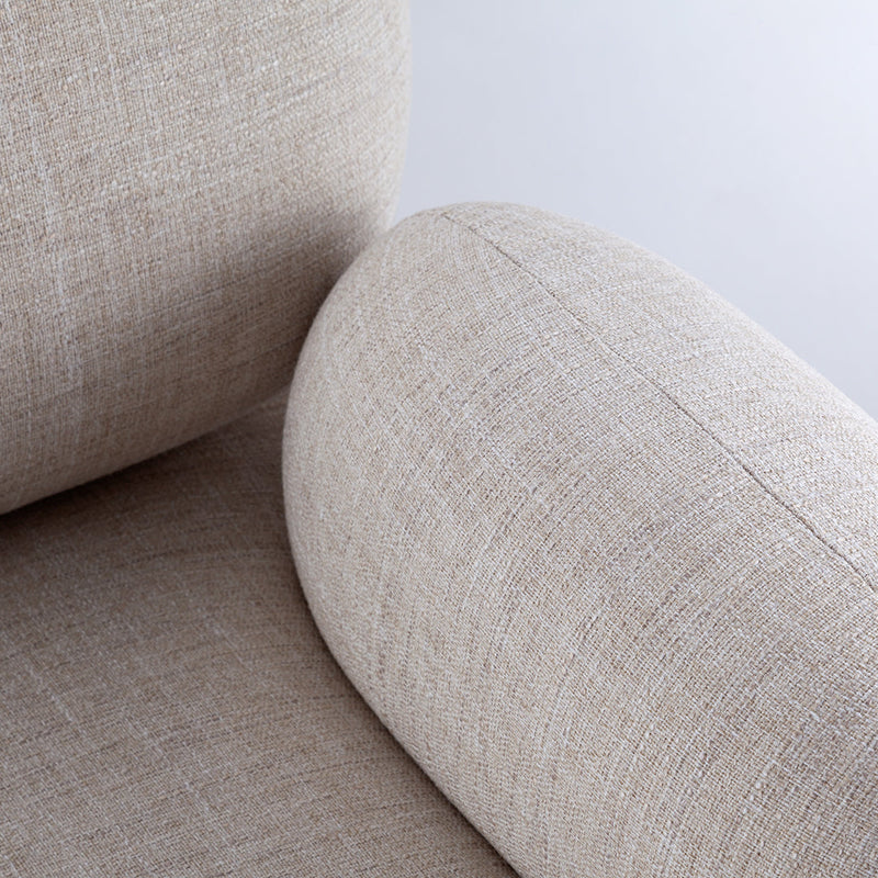 Light beige textured upholstery with a subtle linen pattern, featuring smooth, rounded armrests.