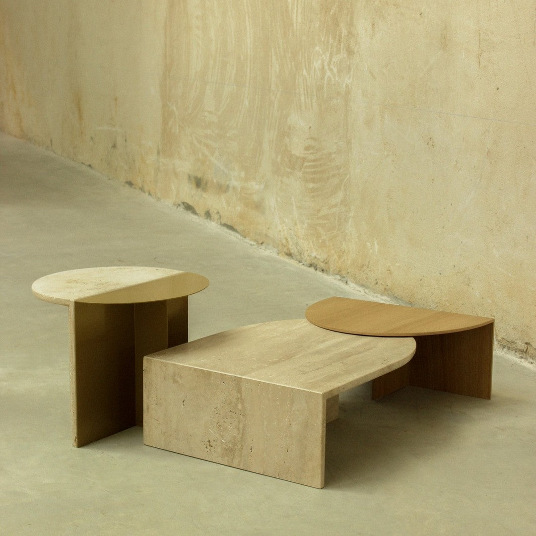 Set of three modern coffee tables in beige and natural wood tones, featuring smooth curves and minimalist design.
