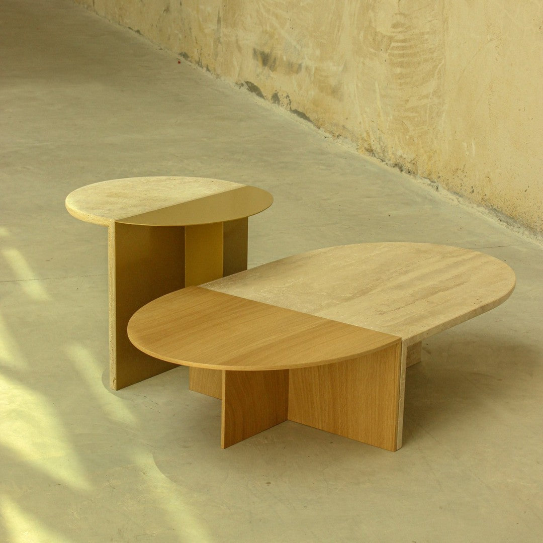 "Natural wood coffee tables with oval shapes, featuring smooth light and warm beige finishes and minimalistic design."