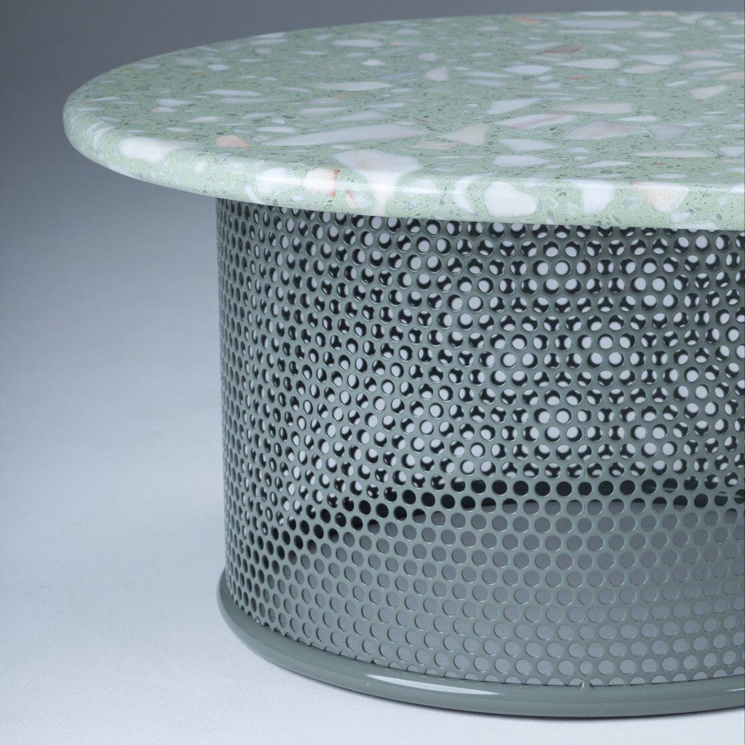 Green patterned tabletop with a geometric grey mesh base, creating a modern and stylish look.